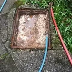 Fernhurst, Blocked residential drain inspection chamber before clearance