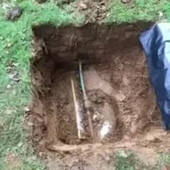 Drain Repairs, Drainage pipe exposed in an excavated trench during a repair